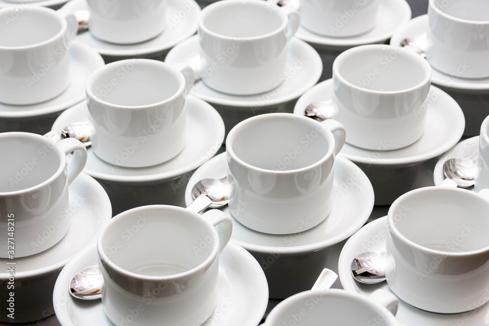 Many empty white tea cups abstract food industry background texture, repetitive pattern Cups stacked with spoons wallpaper White dishes, catering and food service banquet preparations abstract concept Many empty white tea cups abstract food industry background texture, repetitive pattern Cups stacked with spoons wallpaper White dishes, catering and food service banquet preparations abstract concept