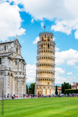 Obraz na płótnie Picturesque landscape with church and famous sloping tower in Pisa, Italy. fascinating exotic amazing places. w salonie