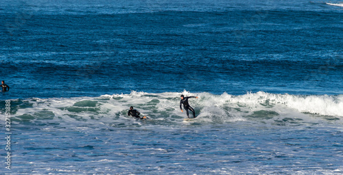 Canvas Print Sport surfing on the beach of zurriola located in san sebastian spain