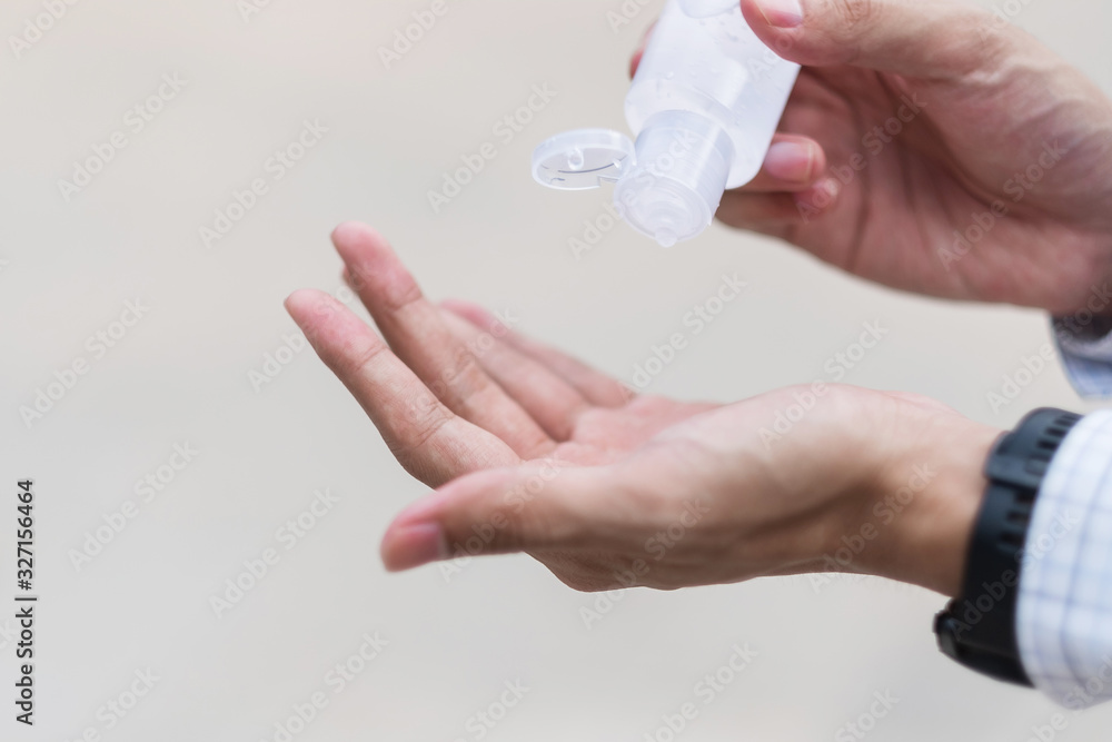 man hands using wash hand sanitizer gel dispenser, against Novel coronavirus or Corona Virus Disease (Covid-19) at public train station. Antiseptic, Hygiene and Healthcare concept man hands using wash hand sanitizer gel dispenser, against Novel coronavirus or Corona Virus Disease (Covid-19) at public train station. Antiseptic, Hygiene and Healthcare concept