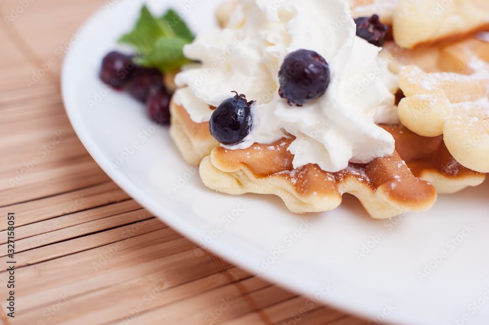 Belgian waffles with fresh berries and mint