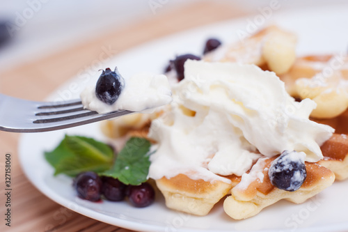 Belgian waffles with fresh berries and mint