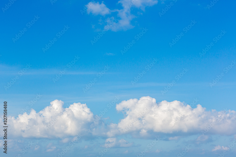Blue sky background with tiny clouds. Sky is a beautiful patterned cloud in the daytime during the summer is a panoramic image. Blue sky background with tiny clouds. Sky is a beautiful patterned cloud in the daytime during the summer is a panoramic image.