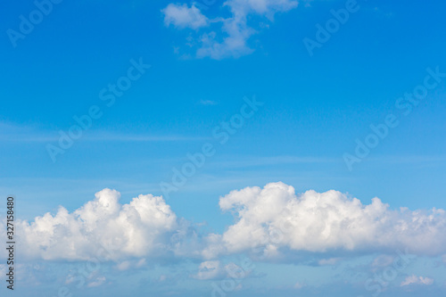 Blue sky background with tiny clouds. Sky is a beautiful patterned cloud in the daytime during the summer is a panoramic image.