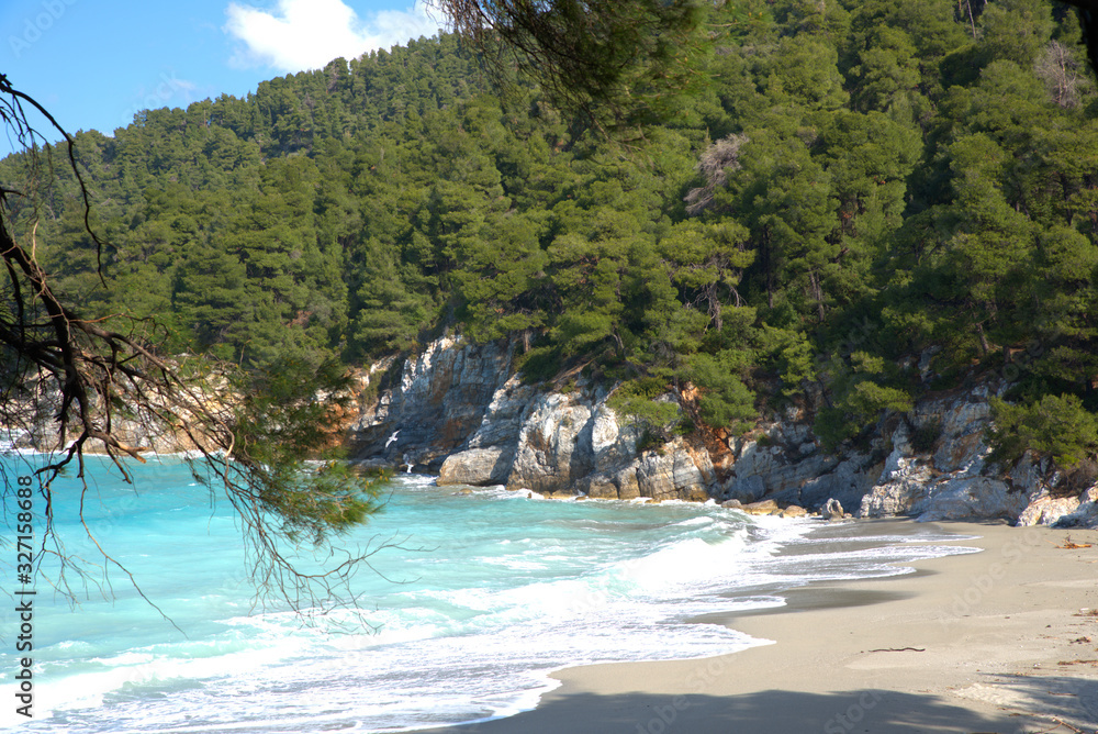 A beautiful beach on the island of Skopelos, Greece . her name is Kastani beach A beautiful beach on the island of Skopelos, Greece . her name is Kastani beach