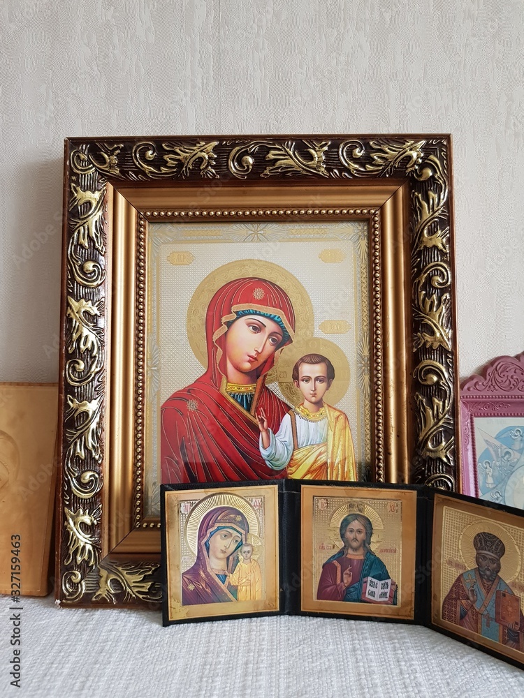 Fototapeta premium Orthodox icons on the shelf