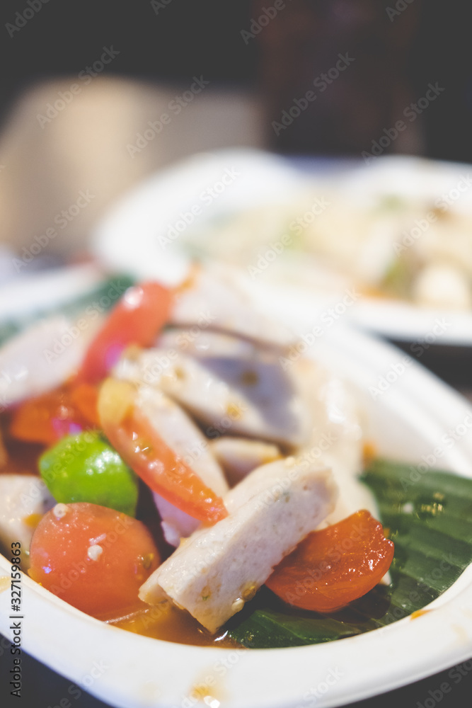 Close up of Thai salad with Vietnamese pork sausage.