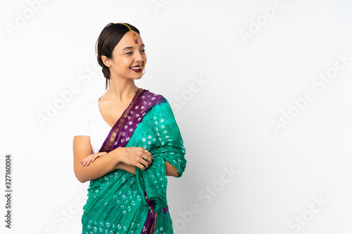 Young indian woman isolated on white background looking to the side