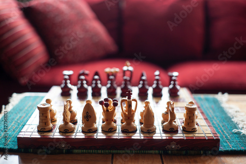 Chess board and red sofa