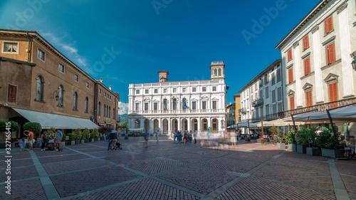 Main square piazza Vecchia in an Italian town Bergamo timelapse. Library and historic buildings.