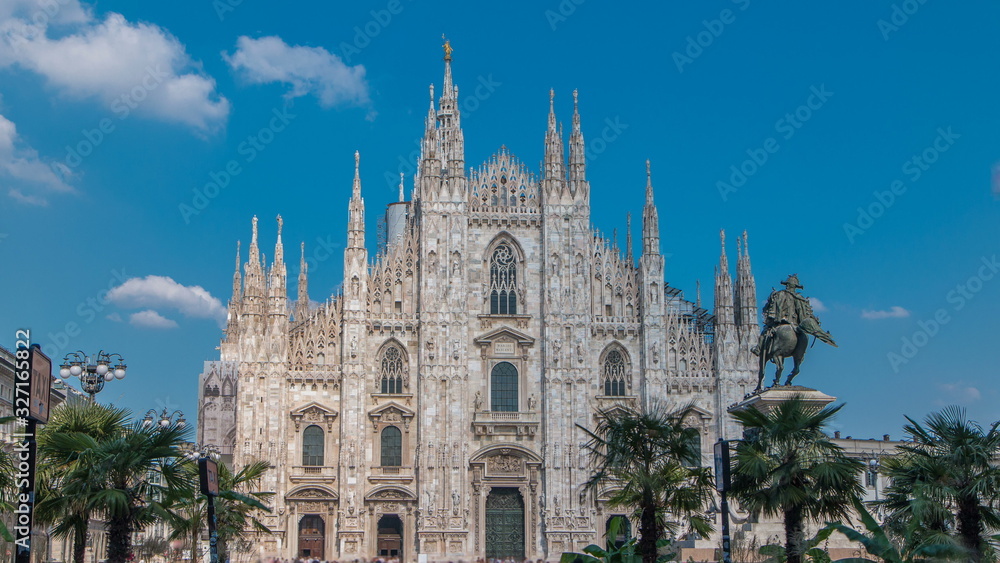 The Duomo cathedral timelapse with palms and monument. Front view with people walking on square