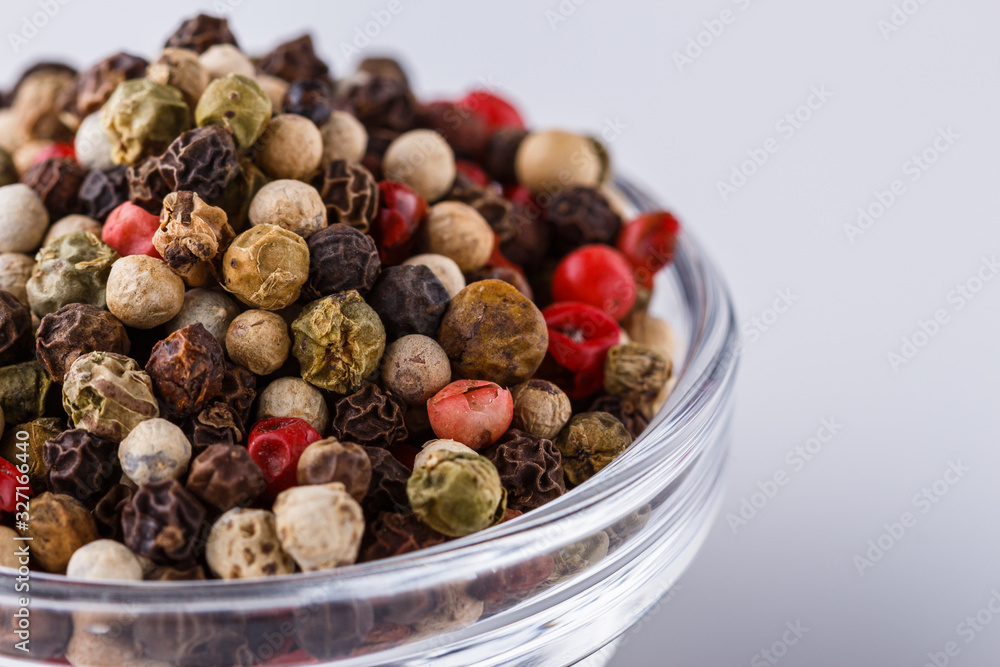 mix of peppercorns on white acrylic background mix of peppercorns on white acrylic background