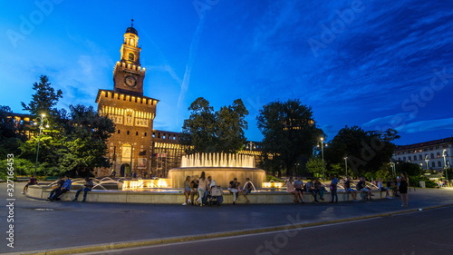 Main entrance to the Sforza Castle and tower - Castello Sforzesco day to night timelapse, Milan, Italy photo
