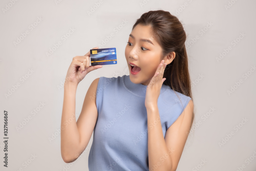 Tourist woman in summer casual clothes.Asian Smiling woman .Passenger traveling abroad to travel on white background.She going to summer vacation.Travel trip funny Credit card on holiday. Tourist woman in summer casual clothes.Asian Smiling woman .Passenger traveling abroad to travel on white background.She going to summer vacation.Travel trip funny Credit card on holiday.