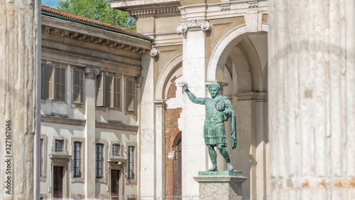 Fotografija Monument to Roman emperor Constantine I timelapse in Milan, in front of San Lorenzo Maggiore basilica