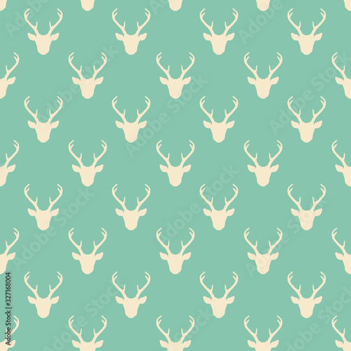 Seamless pattern with deer heads silhouettes