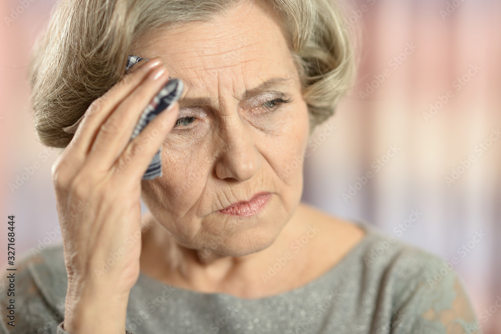 Portrait of beautiful senior woman with headache Portrait of beautiful senior woman with headache