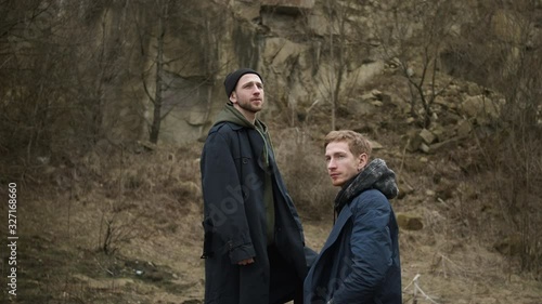 Wallpaper Mural Two Friends In Nature. Stylish Young Guys. One Standing On Stone Above The Other. Torontodigital.ca
