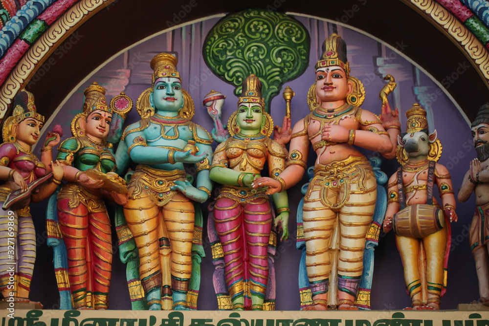 Fototapeta premium bright figures of the gods on the gopurama of a hindu temple in sri lanka