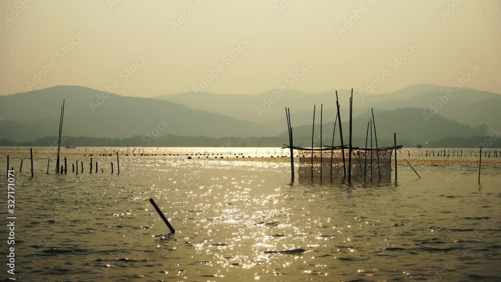 The evening sun and the oyster farm The evening sun and the oyster farm