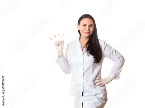 Doctor cosmetician with syringes in hand. Caucasian smiling woman in medical gown and rubber gloves, half-length portrait, isolated on white.