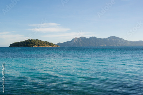 Mallorca landscape on a sunny day. Beach with turquoise water and view of the islands. Majorca, Spain © Hanna
