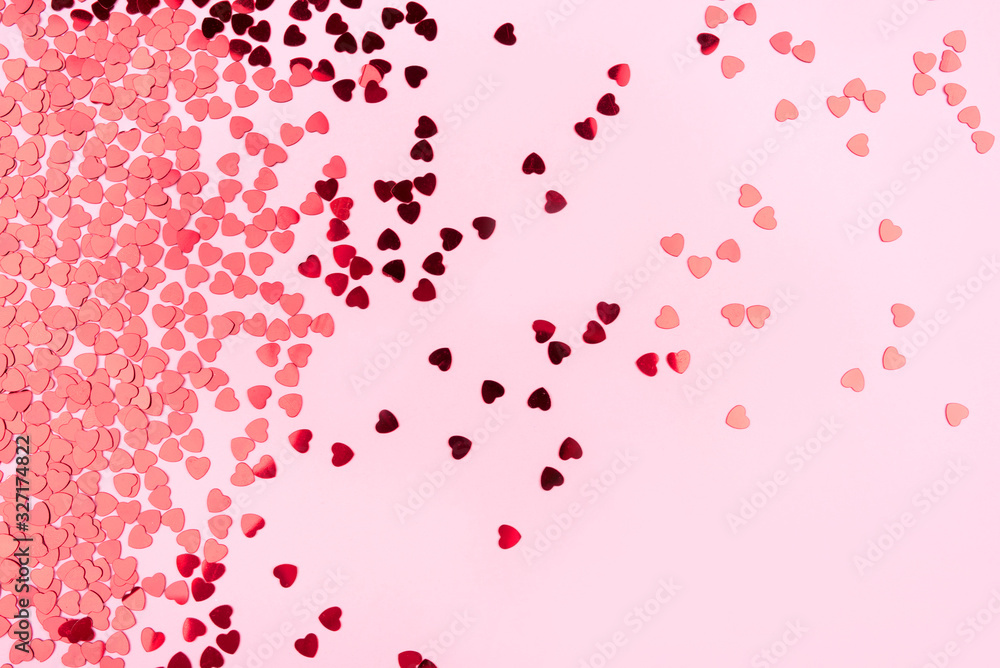 Pink background with red hearts. Valentine's day concept. Top view. Pink background with red hearts. Valentine's day concept. Top view.