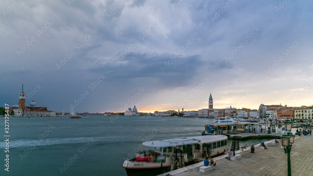 Naklejka premium Basilica Santa Maria della Salute, Cathedral of San Giorgio Maggiore at sunset timelapse, Venezia, Venice, Italy