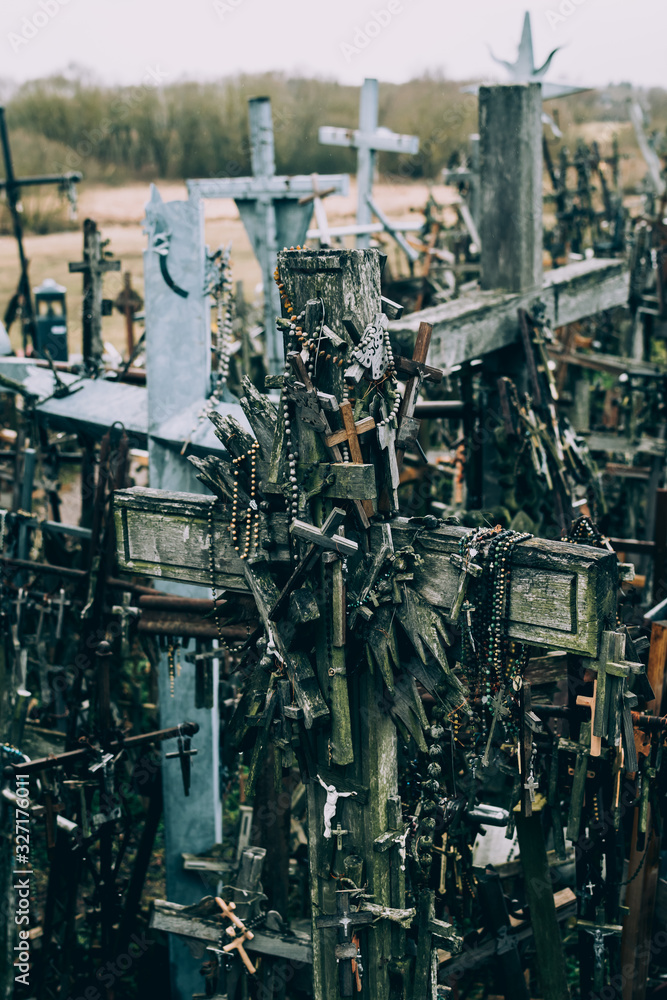 Numerous wooden and metal crucifixes on the hill of crosses
