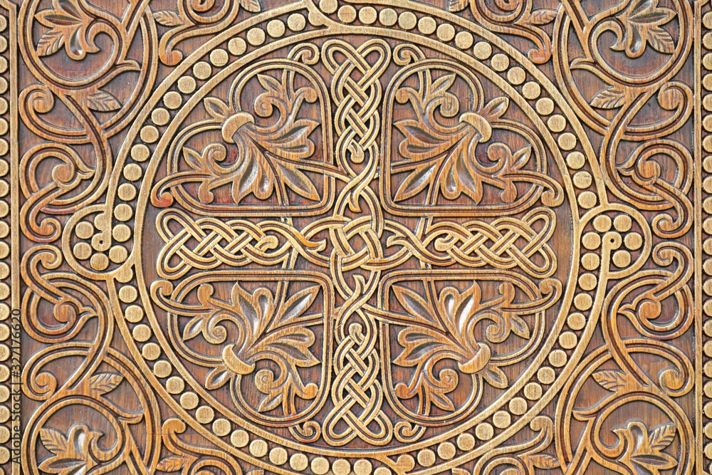 Ornament carved on wood. Gold and black background