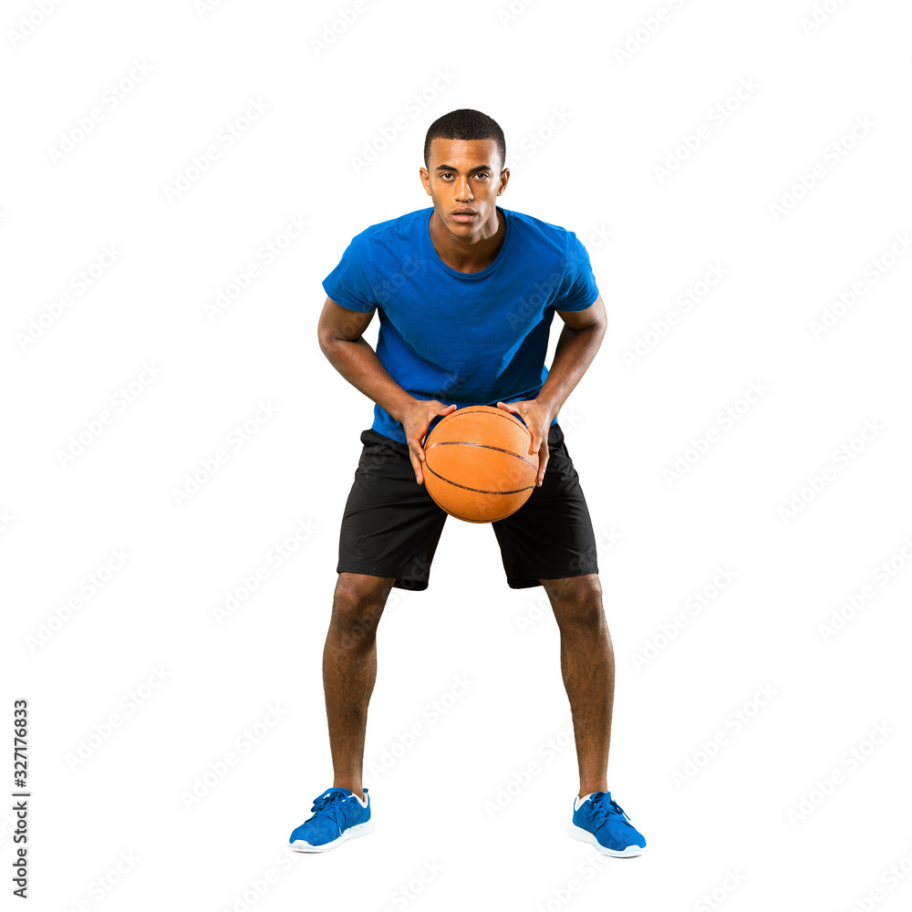Full-length shot of Afro American basketball player man over isolated white background Full-length shot of Afro American basketball player man over isolated white background