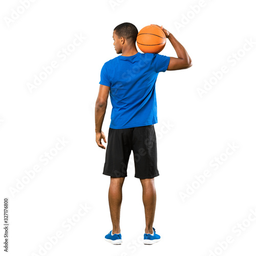Full-length shot of Afro American basketball player man over isolated white background