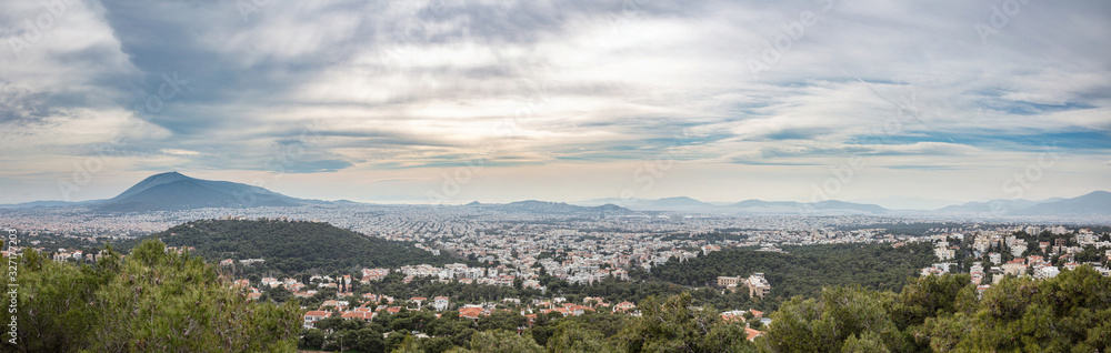 Athens Greece panorama. Aerial view of Athens city from Penteli mount, cloudy winter day.
