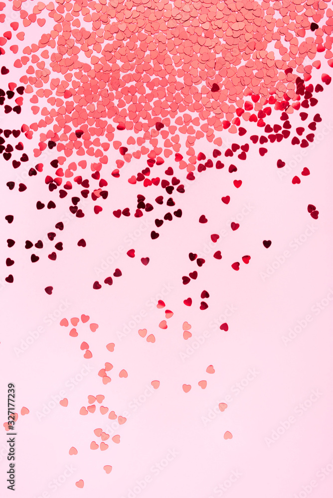 Pink background with red hearts. Valentine's day concept. Top view.