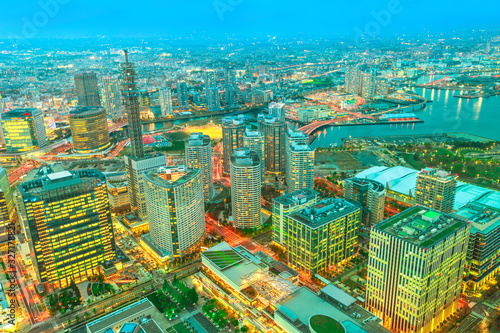 Aerial view of Yokohama Skyline at twilight from viewing platform of Landmark Tower in Minato Mirai district. Skyscrapers and downtown from observatory sky garden.