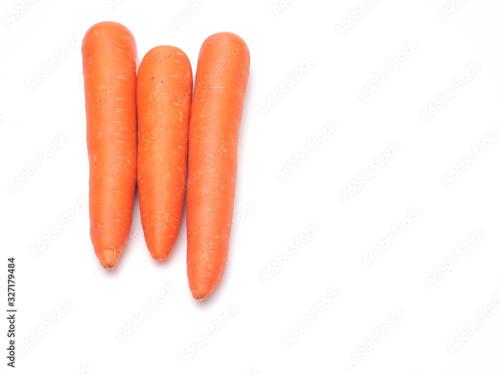 Three carrots isolate on white background.Have copy space.for banner,wallpaper. Three carrots isolate on white background.Have copy space.for banner,wallpaper.