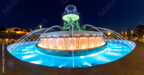 Schilderij op canvas Sizable landmark Triton Fountain, featuring multiple bronze tritons in Old Town
