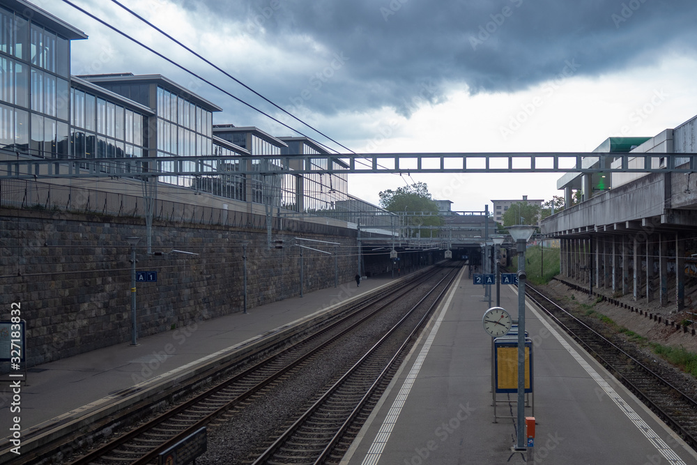 Naklejka premium Empty platform at train station in midtown of Zurich on cloudy sky and background with copy space , Switzerland