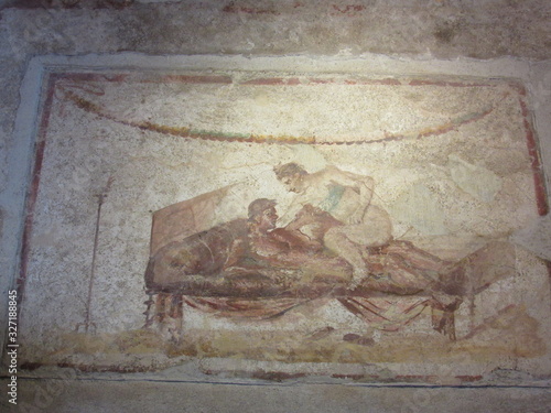 View of painted poses on the wall of the brothel located in Pompeii, Italy 