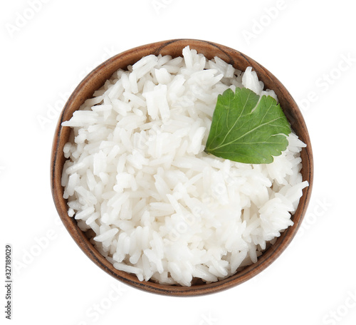 Wooden bowl with cooked rice and parsley isolated on white, top view