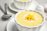 Delicious corn cream soup in bowl, closeup