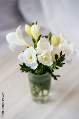Wallpaper Mural white freesia flowers in a glass Torontodigital.ca