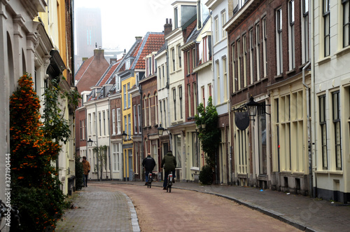 Two men riding bikes on a Utrecht street