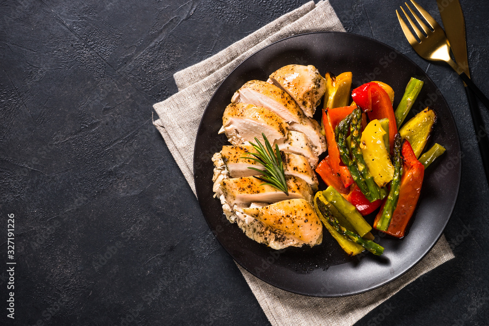 Baked chicken with vegetables top view. Baked chicken with vegetables top view.