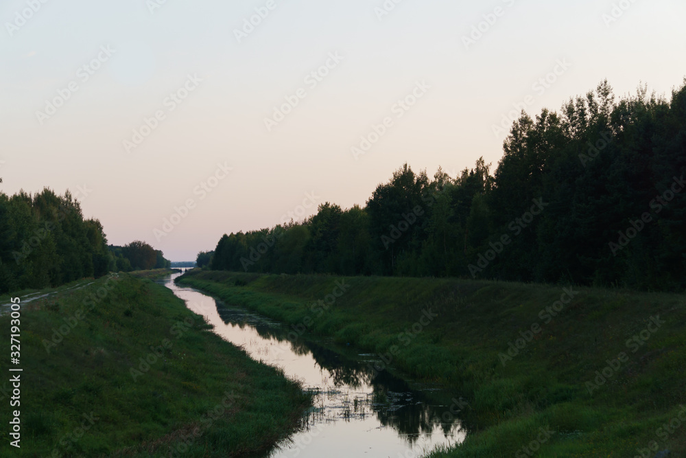 A small river flows from the lake. A small river flows from the lake.