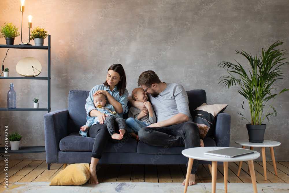Obraz premium Young Family Playing Together on the Sofa. happy family. home comfort.
