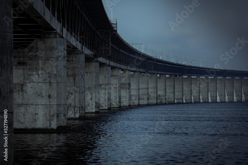 The concrete pillars holding up the Öresund bridge on a dark gloomy day by the sea in Malmö, Sweden