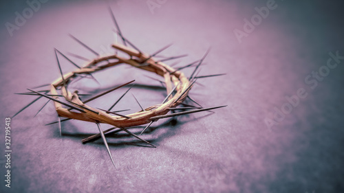 Lent Season Holy Week and Good Friday concepts -image of crown of thorns in purple vintage background