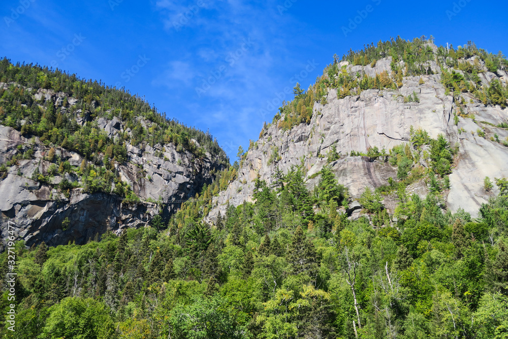 Mountains with suspension bridge at Saguenay fjord national park