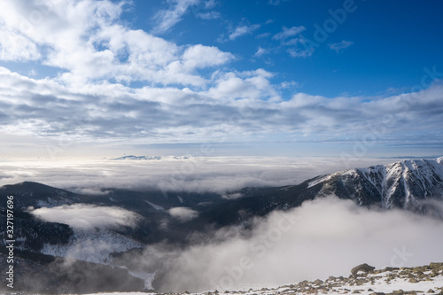 Snow covered mountains with clouds and mist in valley, Low Tatras Dumbier, Slovakia © Martin